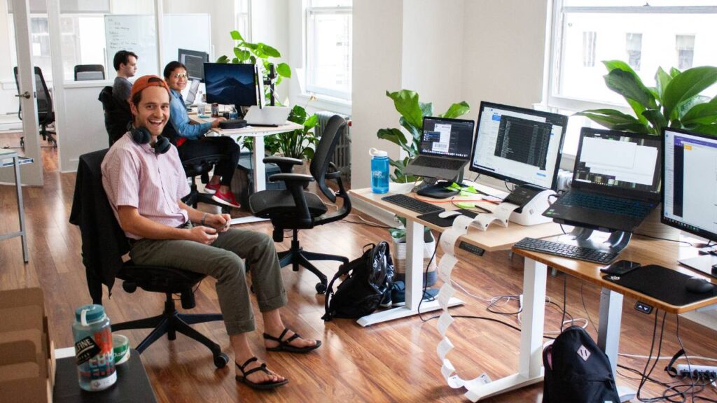 A well-lit workspace with happy workers