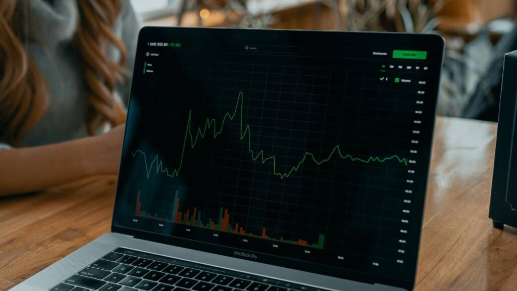 A photo of a laptop screen with an analytics chart