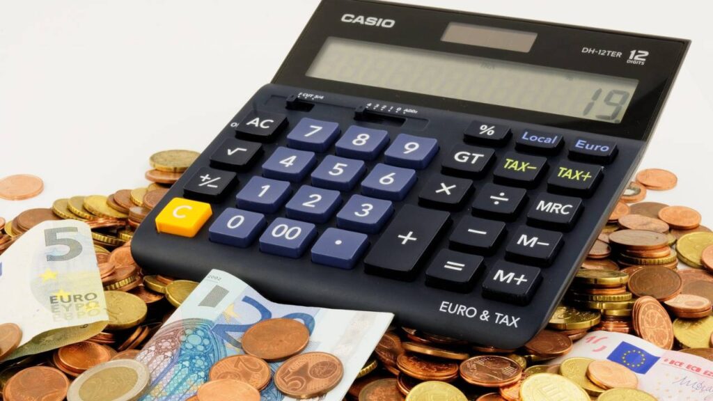 A calculator placed on Euro coins and bills