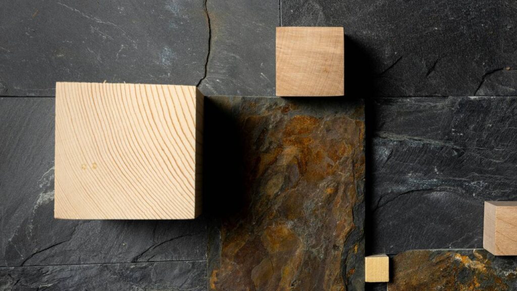 Squares made out of wood placed in a natural stone wall