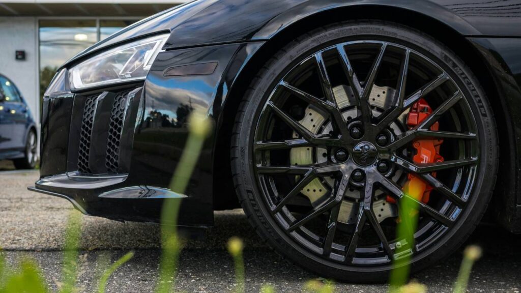 A close-up photo of a wheel of a sports car
