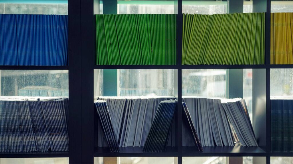 Folders with important documents placed on shelves