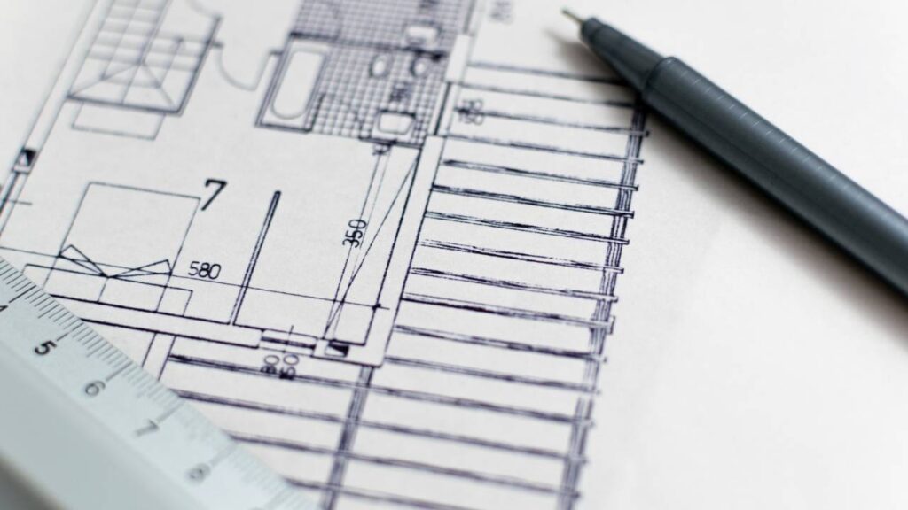 A piece of paper with a construction plan drawn on it