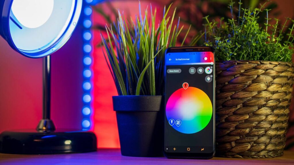 A photo of a smartphone with an app that controls lighting