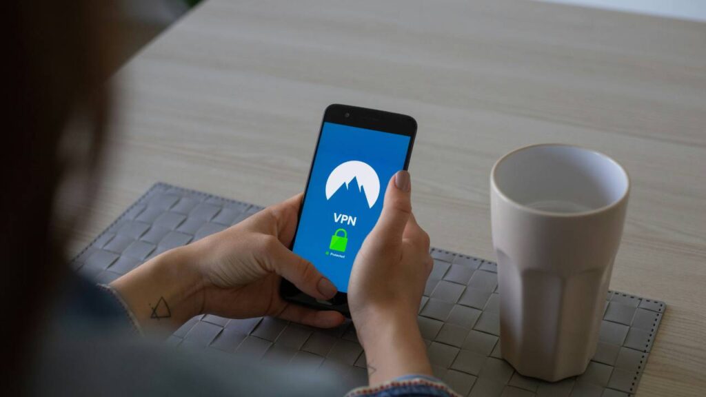 A woman using a smartphone that is protected by VPN