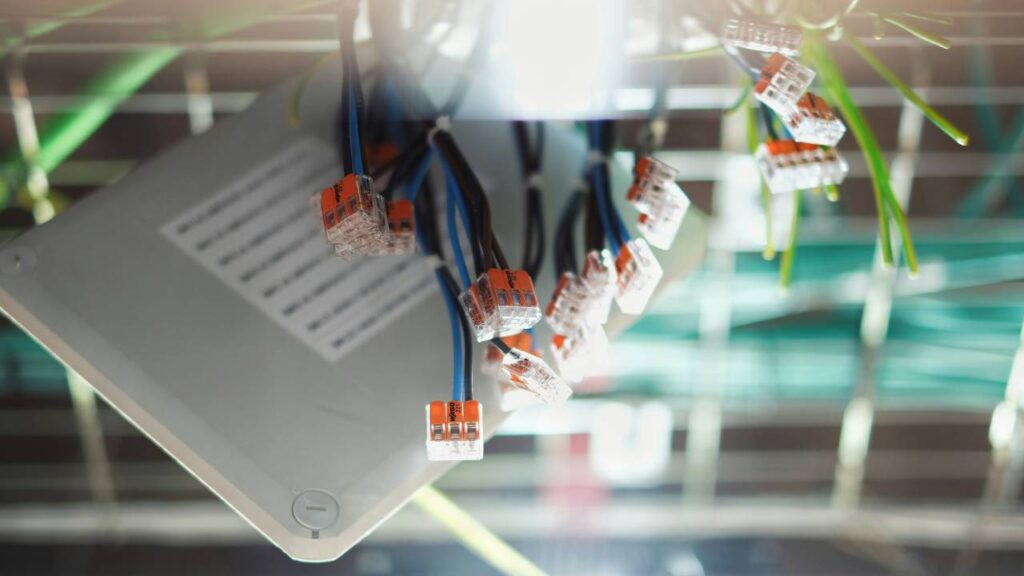 A photo of several wires sticking out of a box